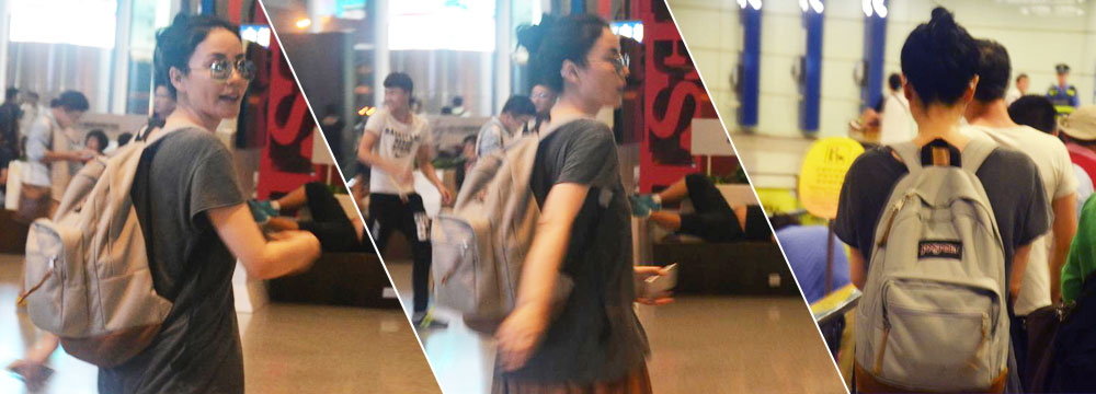 天后平民范儿！王菲低调现身机场忙闪人