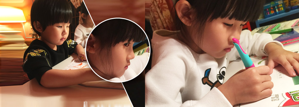 陆毅两女儿认真写作业 贝儿偷瞄镜头
