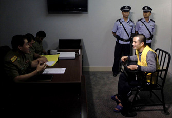 老挝警方来华提审湄公河案主犯糯康