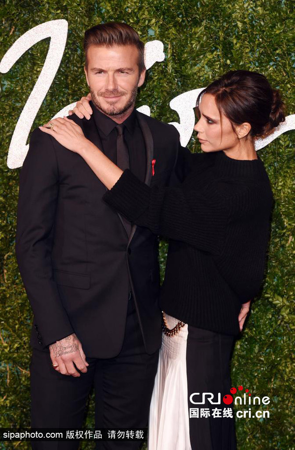 2014英国时尚大奖 贝克汉姆夫妇到场 图片来源:Sipaphoto