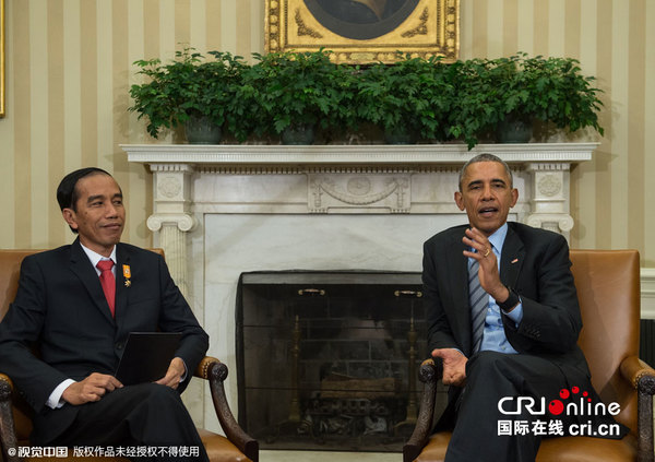 　　当地时间2015年10月26日，美国华盛顿，美国总统奥巴马与印尼总统佐科&middot;维多多在白宫会晤，这是佐科&middot;维多多就任总统后首次访美。图片来源:NICHOLAS KAMM/视觉中国