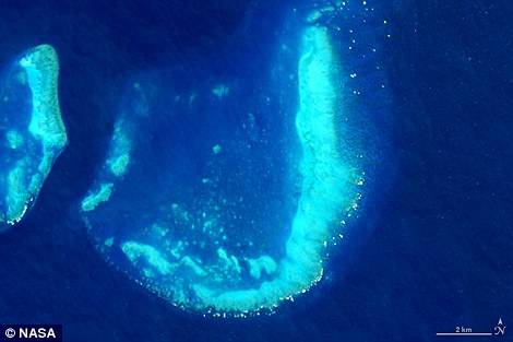 　　J：澳大利亚汤斯维尔附近海域的“树干珊瑚礁”，图片来自Landsat8成像仪↑