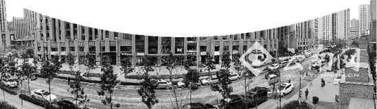 一条马路贯穿滨江俊园，小区没有围墙。